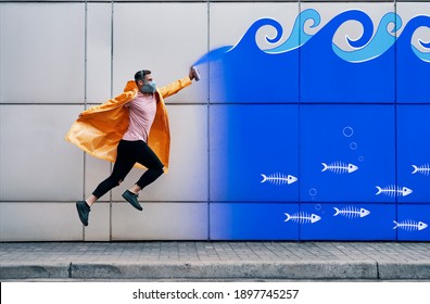 Street artist jumping to paint graffiti in underwater lifestyle. Urban art concept
