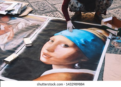 A Street Artists Is Working On A Large Copy Of A Famous Girl With A Pearl Earring Oil Painting By Dutch Golden Age Painter Johannes Vermeer In Florence Italy In October Of 2018