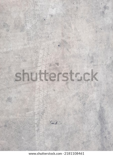 street, Black car tire floating on the road\
concrete., Cement floor For the\
background.
