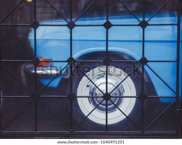 street cafe with blue retro\
cars