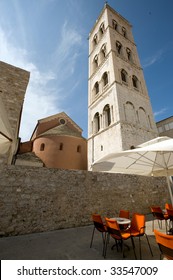 Street Cafe Near Bell Tower Of St. Anastacia In Zadar, Croatia