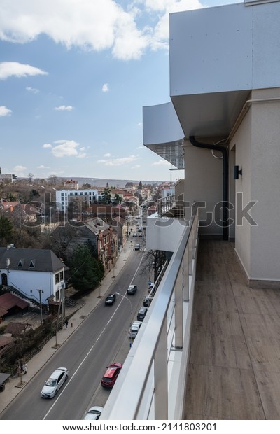 street\
with cars and houses in the city. vertical\
photo