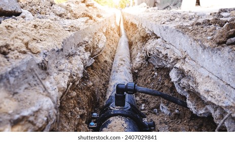The street of the city is torn down.Construction underground utilities in street site, Repair,  laying water pipes or replacing sewer pipes Installation of plumbing, sanitation and drainage systems.