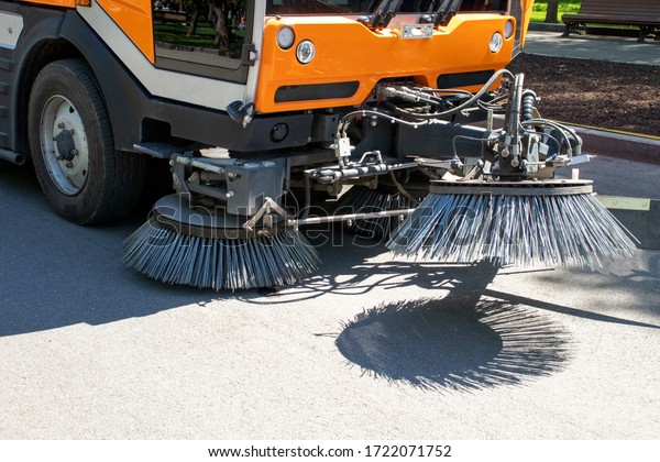 Street cleaning equipment. Brushes of street\
cleaning machine. Street disinfection during the epidemic. Epidemic\
coronavirus 2019-nCoV.