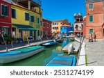 Street with colorful buildings in Burano island, Venice, Italy. Architecture and landmarks of Venice, Venice postcard