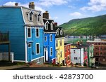 Street with colorful houses near ocean in St. John