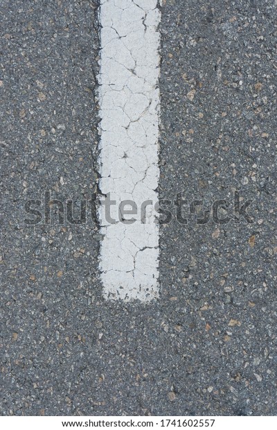 Street concrete with a white car\
line signal in the middle. Concrete street for\
background.