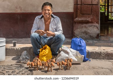 Street Craft Vendor In Mexico
This Craftsman Creates Small Wooden Mules As Decoration Purposes