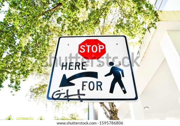 street crossing\
sign in miami city usa\
america