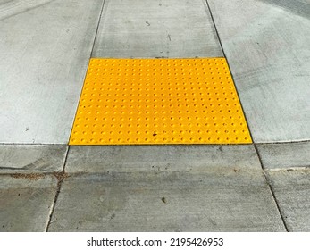 A Street Crosswalk Pedestrian Walkway Intersection Warning Disabled Handicapped Caution Assistance Raised Yellow Bumps Sidewalk