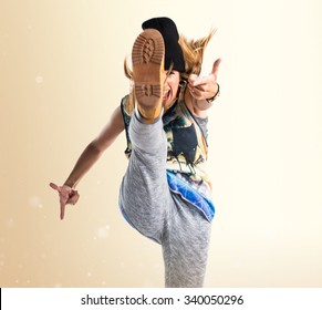 Street dance woman giving a kick