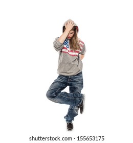 Street Dancer Girl Wearing Jeans With Hood On Her Head, Isolated On A White Background. Young Female Performer Dancing In Studio.   