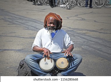 Street Drummer Rasta Man From Jamaica Is Having Fun With Drumming On Two Bongo Drums In San Francisco, California. June 9, 2018.