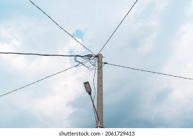 Street Electric Pole With Many Electrical Wires And Fiber Optic Cables