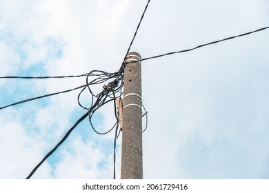 Street Electric Pole With Many Electrical Wires And Fiber Optic Cables