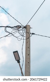 Street Electric Pole With Many Electrical Wires And Fiber Optic Cables