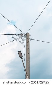 Street Electric Pole With Many Electrical Wires And Fiber Optic Cables