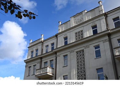 Street Facade Of A Historic Building With An Ornate Parapet