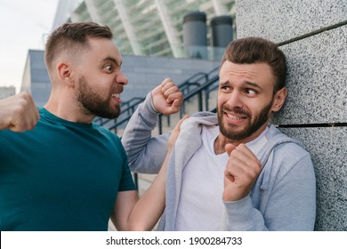 Street Fight Of Two Adult Men. One Guy Threatening Another.