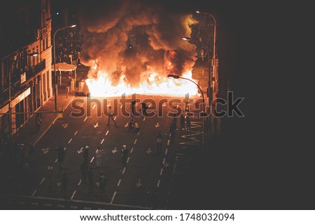 Street in flames with protestants