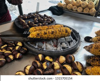 Street Food. Roasting Corn And Brown Chestnuts. Culinary Process. Athens, Greece