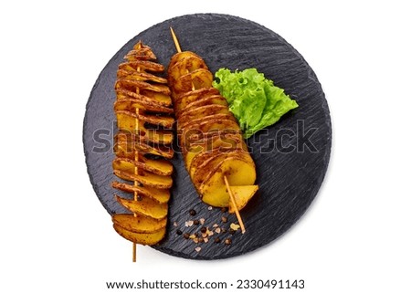 Street food. A spiral fried potatoes, isolated on white background
