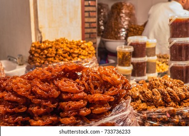 A Street Food Stall In Morocco. Pastry And Patisserie Are Exhibited For Sale In Bags. 