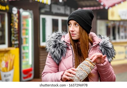 Street food. young woman holding Trdlo or Trdelnik, Traditional tasty baked Czech Republic and eating oudoor winter - Shutterstock ID 1637296978