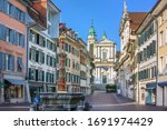 Street with fountain and Cathedral in Solothurn, Switzerland