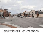 Street in Frisco, Colorado, on a snowy day. Picturesque north american city in the heart of rockies. Some traffic visible.