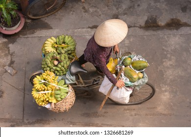 street fruits bicycle vendor in Ho Chi Minh City, Vietnam, seen in top view.