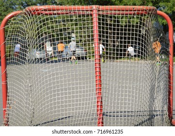 Street Hockey Game Behind The Net