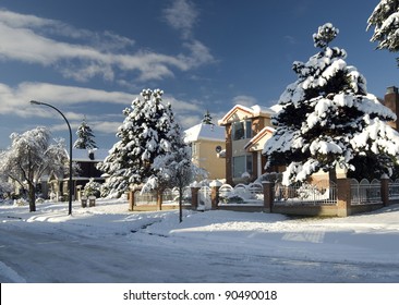 Street And Homes Under Snow In Vancouver, BC, Canada