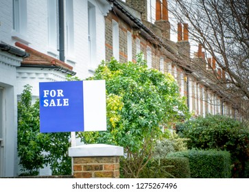 A Street Of Of House With 'For Sale' Sign- UK