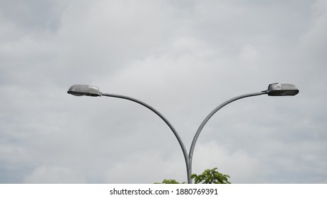street lamp with blue sky and white clouds as background