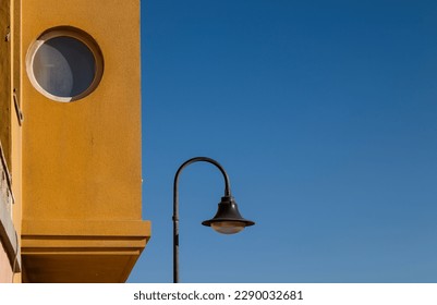 Street lamp on a small town against sky. Almeria, Spain