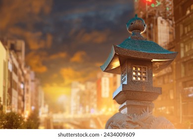 Street lamp in oriental style. Stone lantern in residential area. Street lighting equipment. Traditional oriental lantern at sunset. Stone sculpture with dragons. Lantern for lighting courtyard area - Powered by Shutterstock