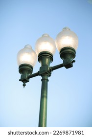 Street lamp post in the blue sky in the city and park 