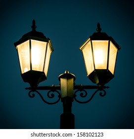 Street Lamp Post At Night Time.