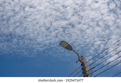  Street Lamp Solar Cell Street Light Under Sky With Small Clouds Scattered Around.