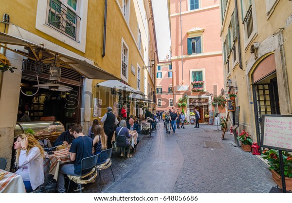 Street Landscape in  Rome Center with people\
walking via the street :April 7,\
2017