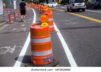 Street With Lanes Delimited By Road Separators. Roadworks. Organization Of Road Traffic Using Traffic Bollards. 