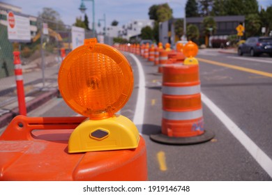 Street With Lanes Delimited By Road Separators. Roadworks. Organization Of Road Traffic Using Traffic Bollards (cone). 