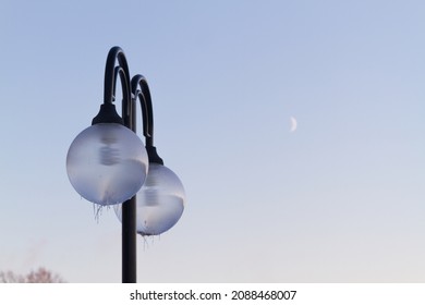 Street Lantern With Ice And Blue Sky On Background