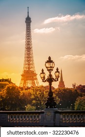 Street lantern on the Alexandre III Bridge against the Eiffel Tower in Paris, France