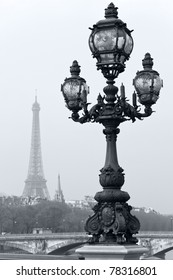 Street lantern on the Alexandre III Bridge against the Eiffel Tower in Paris, France.