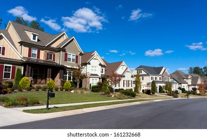 Street of large suburban homes - Shutterstock ID 161232668