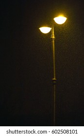 Street Light Glow In Darkness Night And Shine To Winter Snow, Location On The Left (vertical)