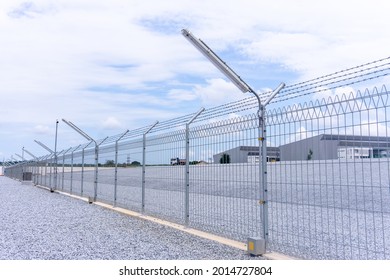 Street Light Installation At Fence Around Factory