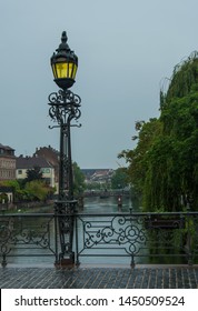 Street light on bridge over river in Strasbourg france 